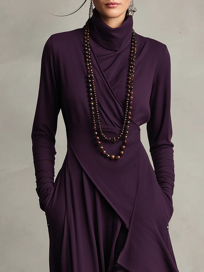Aurelia · Vestido maxi plisado asimétrico con cuello alto